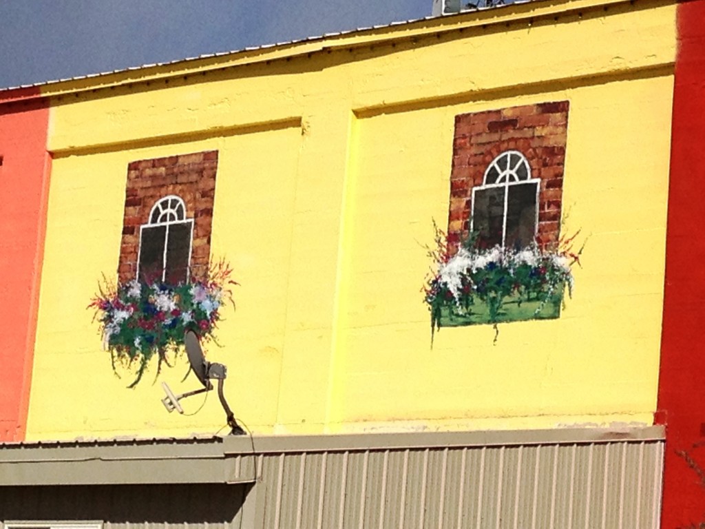 Old Sugar Mill Market - all of the windows and flowers are hand painted