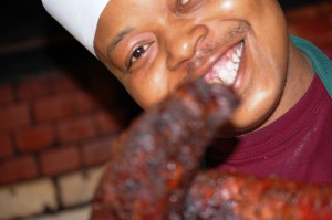 One of the BBQ Masters at Arthur Bryant's shows off the goods!
