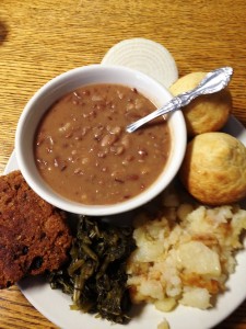 Salmon Patty Dinner with homemade cornbread, greens, fried potatoes and Past Times' famous soup beans 