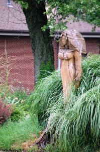 Wooden sculpture in a yard across from Daffin's in Sharon, PA