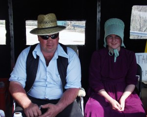 Mennonite father and daughter selling Maple Syrup