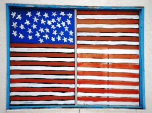 A Flag painted on a window in Tripp, South Dakota