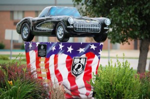 Old Corvette on pedestal at Corvette Museum in Bowling Green, Kentucky