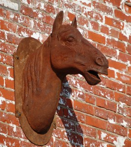 A rustic horse head on a building in downtown Lexington
