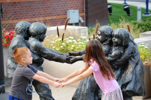 My grandkids emulate the statue at Indy Children's Museum