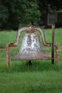 An old bell in someone's yard