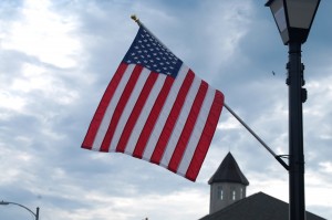 A Flag frames the top of the courthouse in Nebraska City