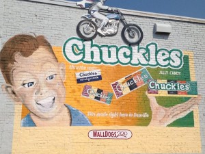 Chuckles Ad with Evel Knievel flying over it....