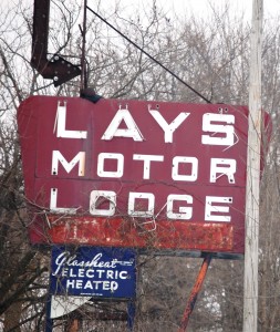 Lays Motor Lodge sign in Kingdom City, Missouri.  Motel building is dilapidated, but the sign remains 