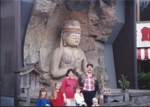 Family at Usuki Buddha statue in Usuki, Oita, Japan ca 1988