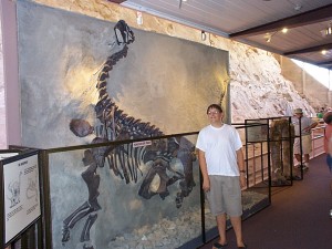 Seth with a dinosaur fossil at Dinosaur National Monument in Dinosaur, Utah