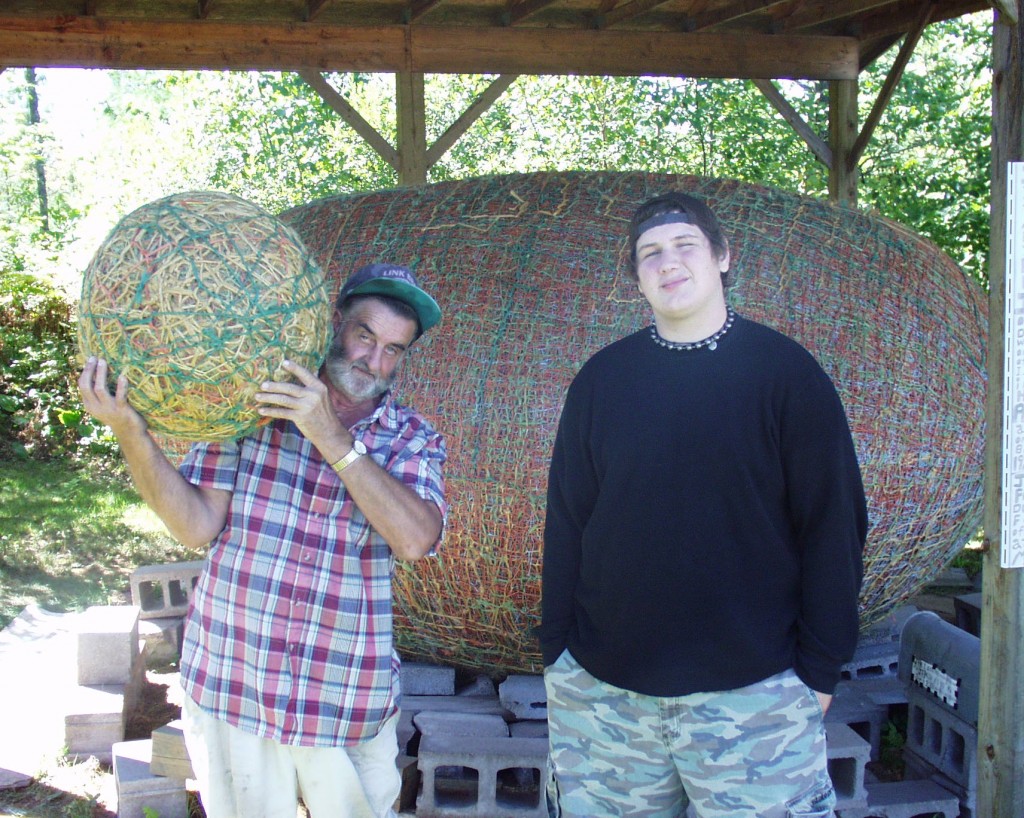 Solomon hanging with James Frank Kotera "JFK" the Twine Ball Man in Lake Nebagamon, WI.  Largest Twine Ball in the World. Sept 2007