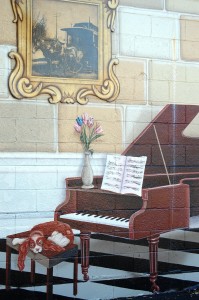 Detail of piano portion of mural on Old Town Liquors in Louisville