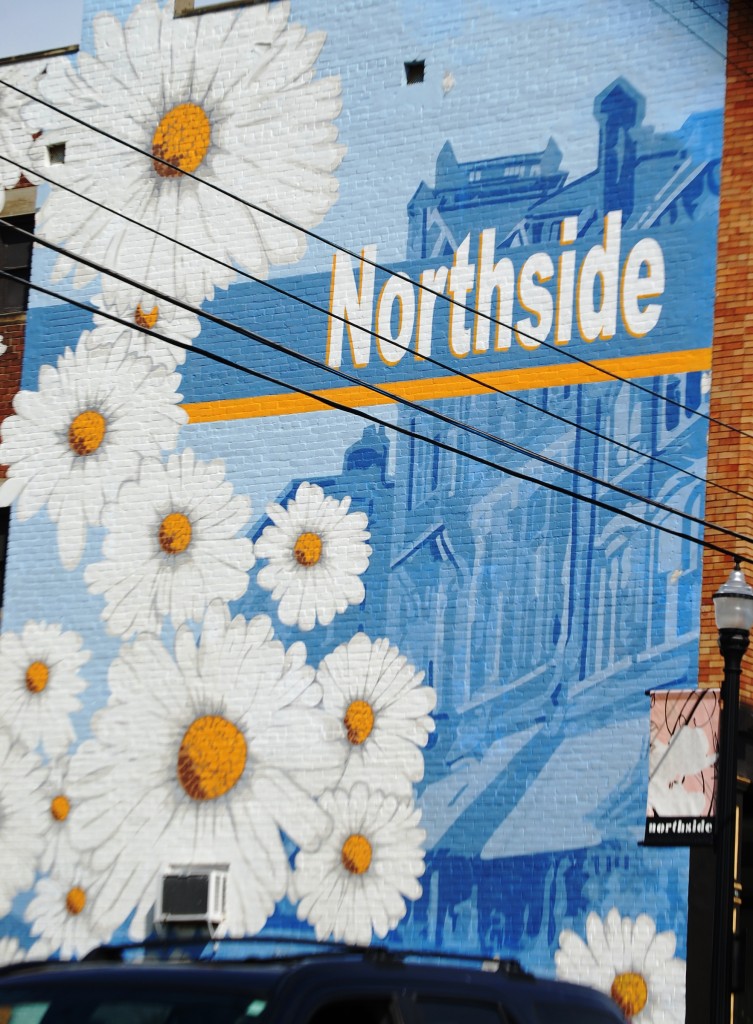 Large Mural on side of building representing the Northside district