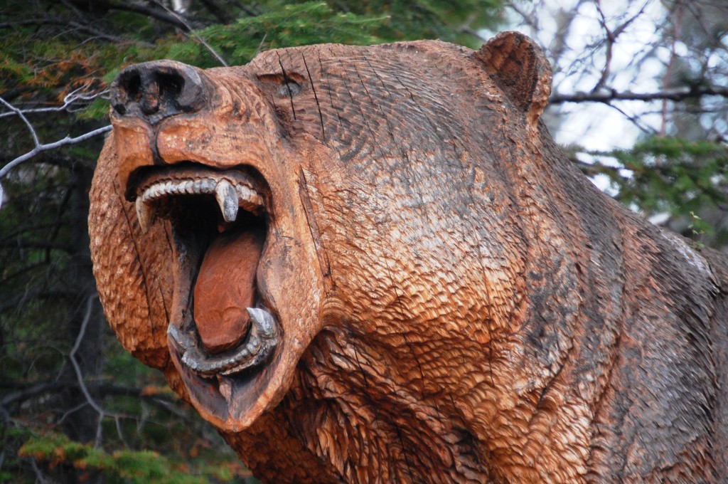 Giant wood carved grizzly head at Grizz Works in Maple, WI