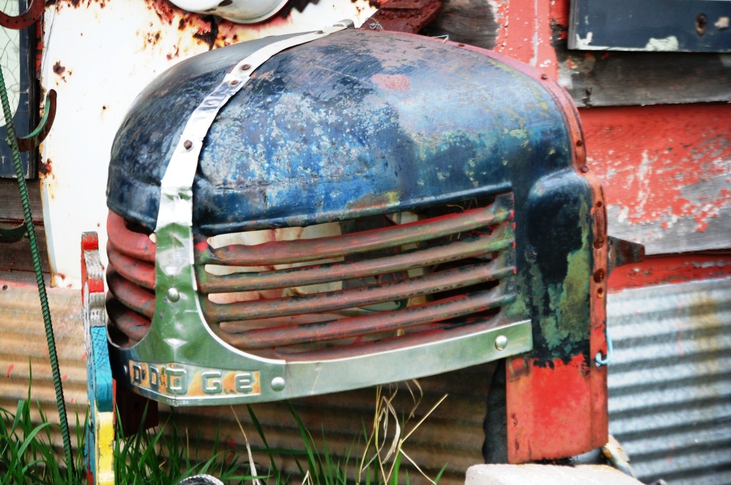 Part of a car hood attached to the building at Boudreau's Antiques