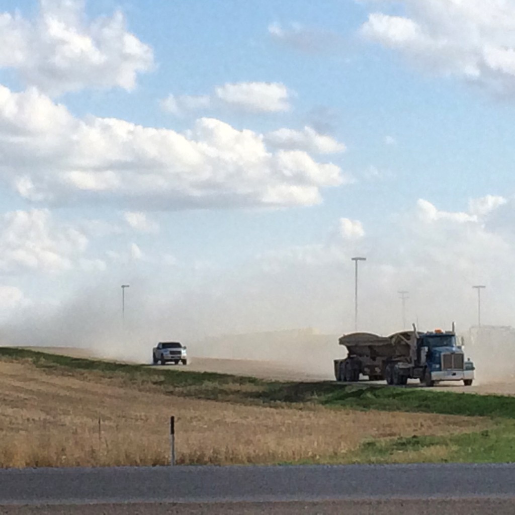 Typical scene in Williston - trucks cruising down dusty dirt roads from the drilling fields