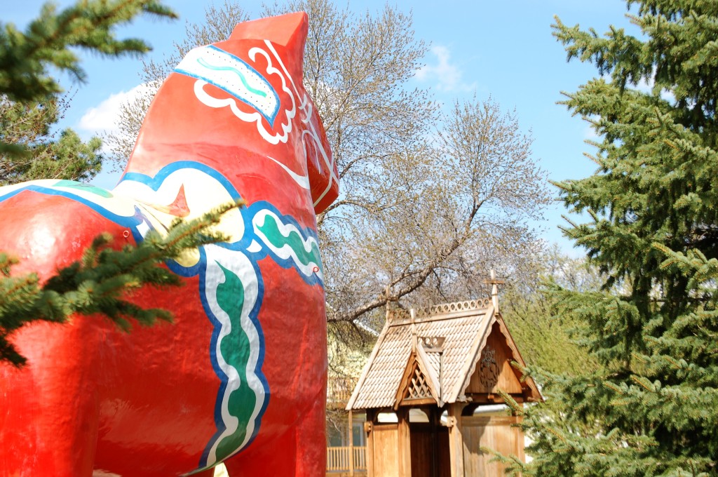 Dala Horse and one of many buildings at the Scandinavian Cultural Heritage Park