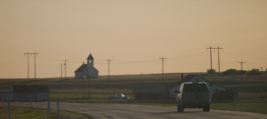 An old church building on the horizon east of Culbertson, Montana on US Hwy 2