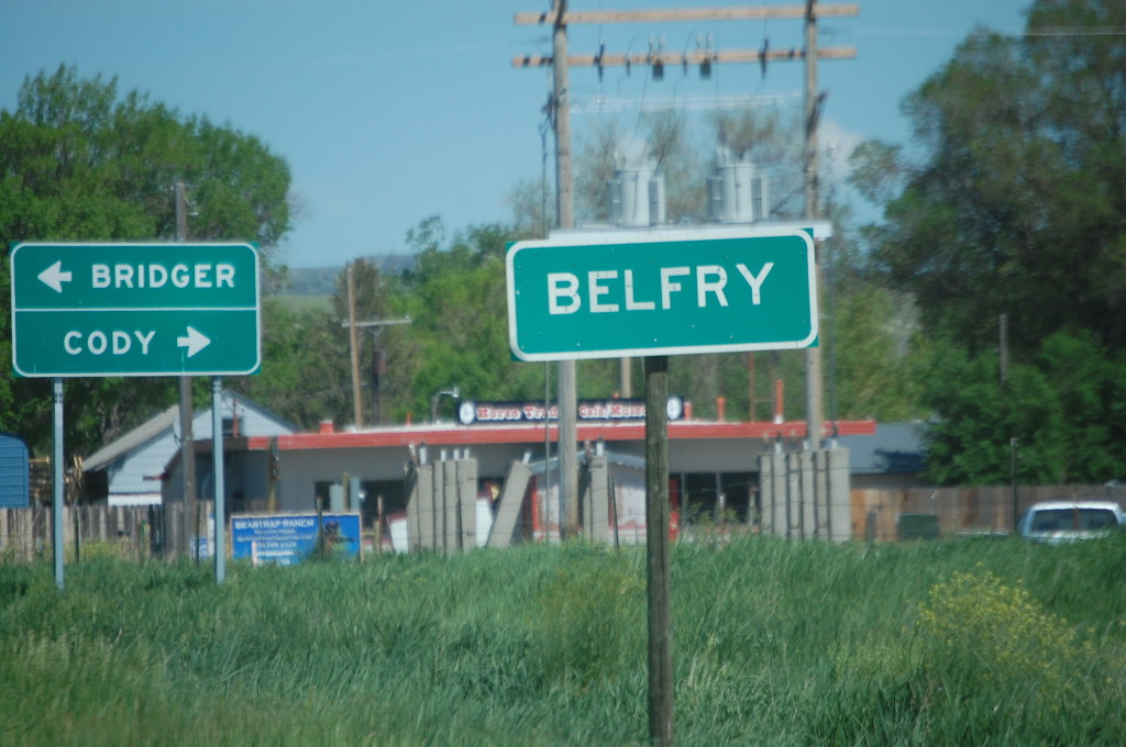 Belfry, Montana with sign to Cody, Wyoming in background