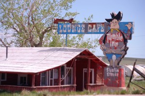 An old neon relic of the past, the Tumble Inn Lounge/Cafe, with a vintage neon look in Powder River, WY