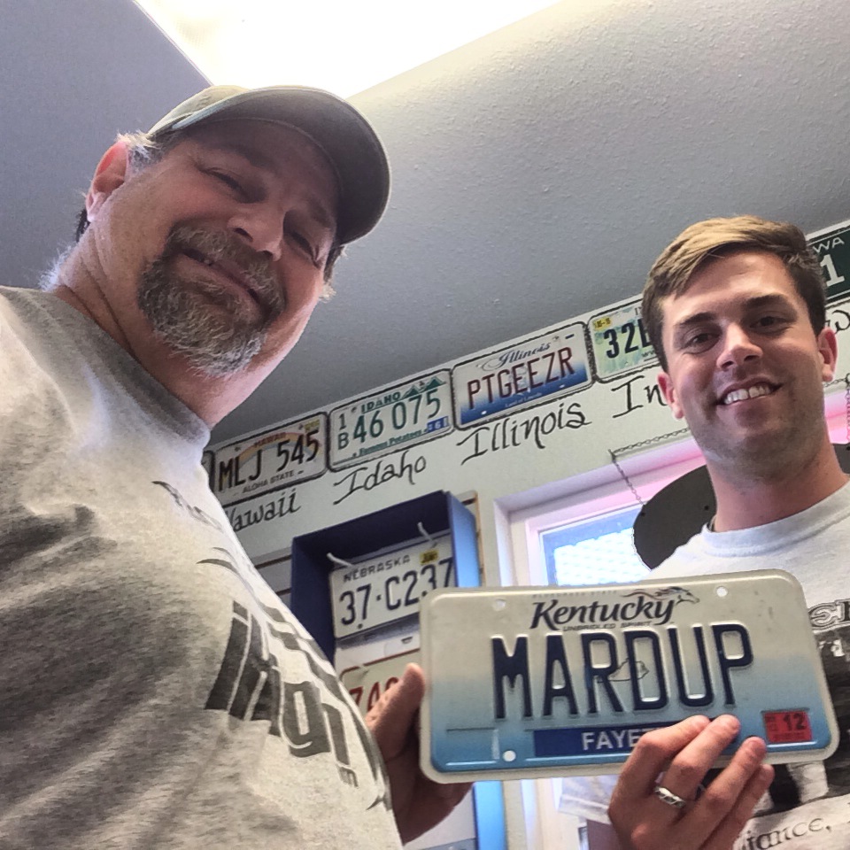Donating MARDUP License Plate to Beau Neville at Carhenge