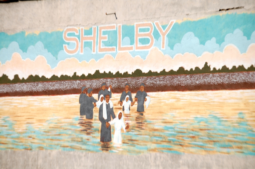 Wall mural depicting a river baptism in Shelby, MS. Its not all about the blues