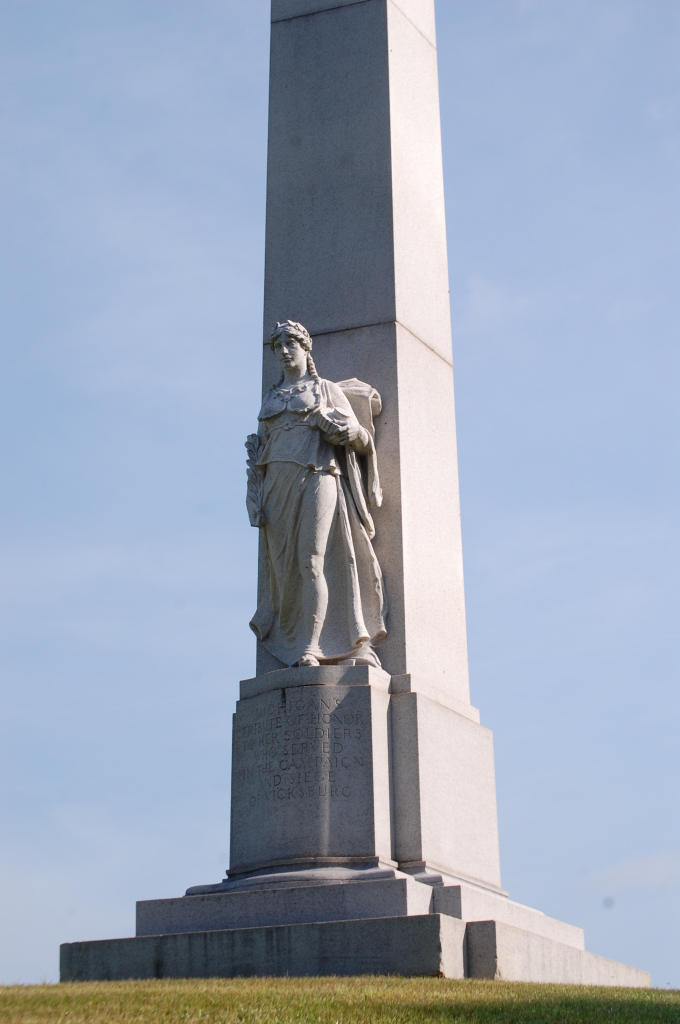 Obelisk with sculpture