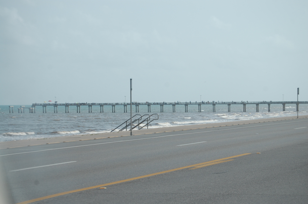 Drive along the Seawall Highway on Galveston Island