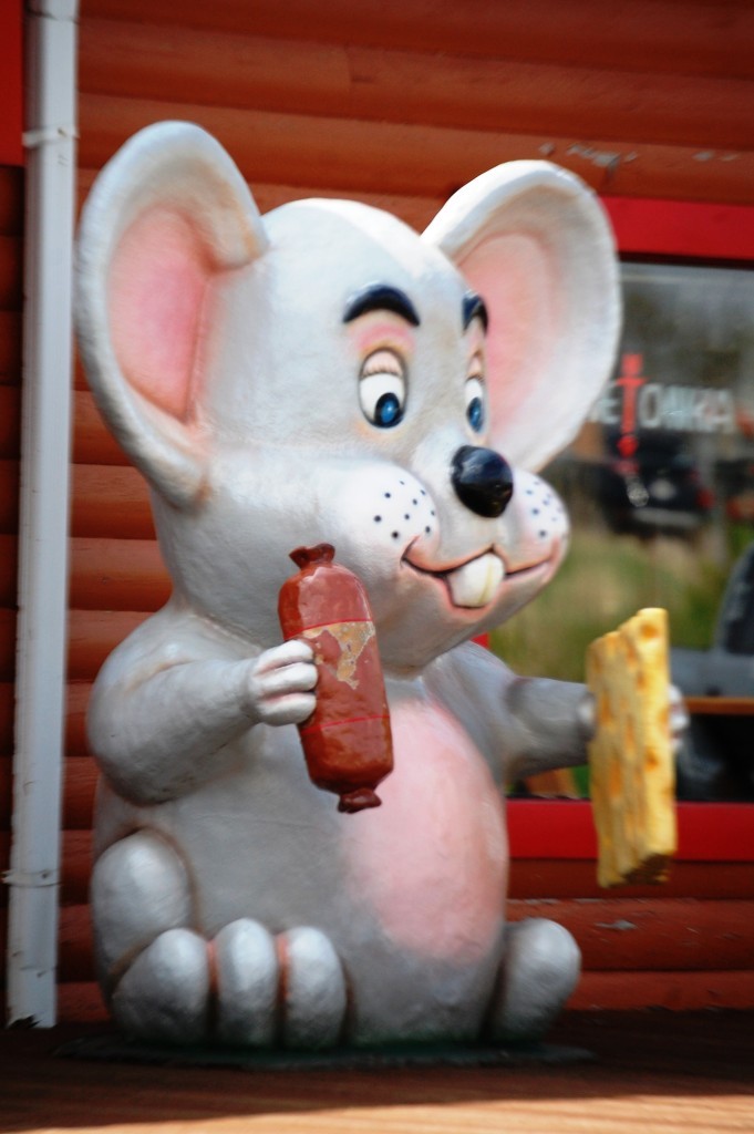 A seven foot tall mouse holding cheese and a wiener in Beloit, WI