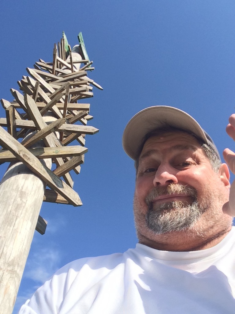 Which way do I go?  A large signpost in Mena, AR