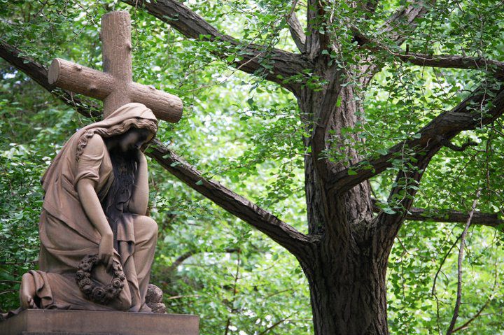 A solemn statue in Lake View Cemetery