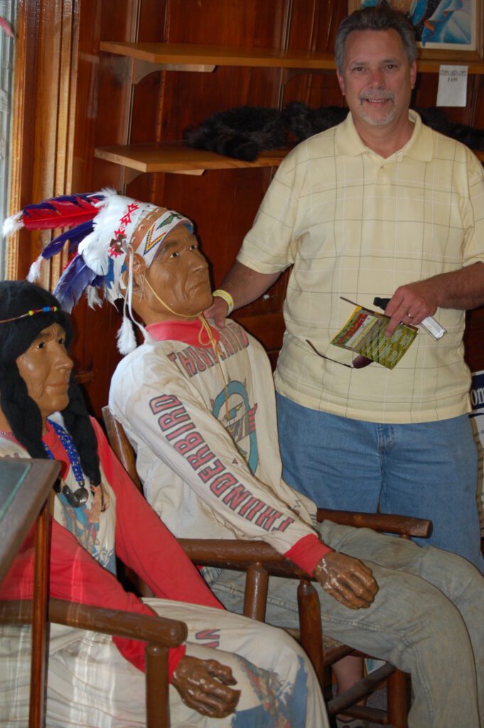 Brother in law with Indians in Wigwam Village gift shop