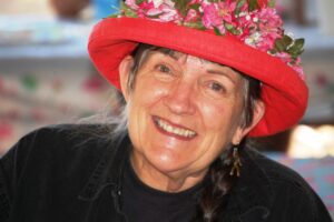 My Kind host Carla Lockwood in her Trailer Park Best flamingo hat at Woodflock