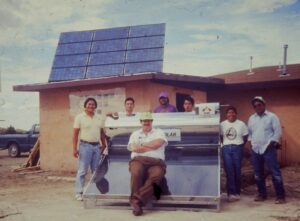 Setting up solar water heater on Hopi Reservation in 1990