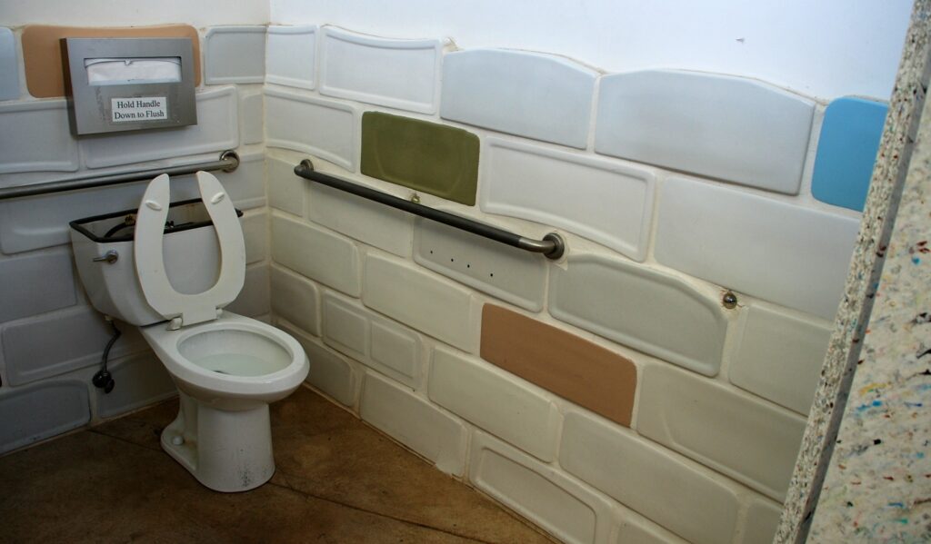 The "weird part" is the recycled toilet tank lids that cover the wall.  Other recycled items can be found within as well.