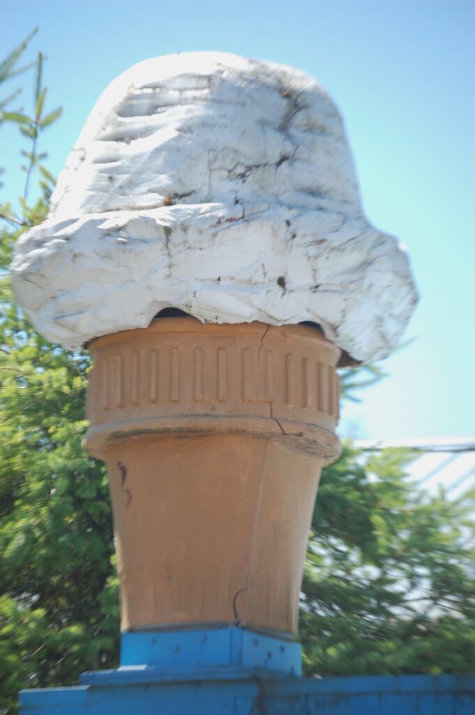 A giant wood-carved ice cream cone at Fat Smitty's