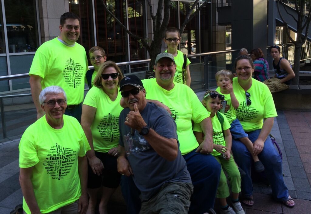 All of us waiting for to Ride the Duck. This guy loved our shirts and wanted a photo with us...yes, we were photobombed in Seattle!