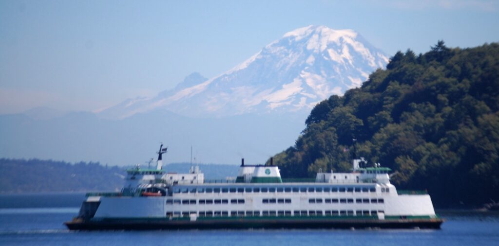 A ferry passes by us in the sound with Mt. Rainier in the backround