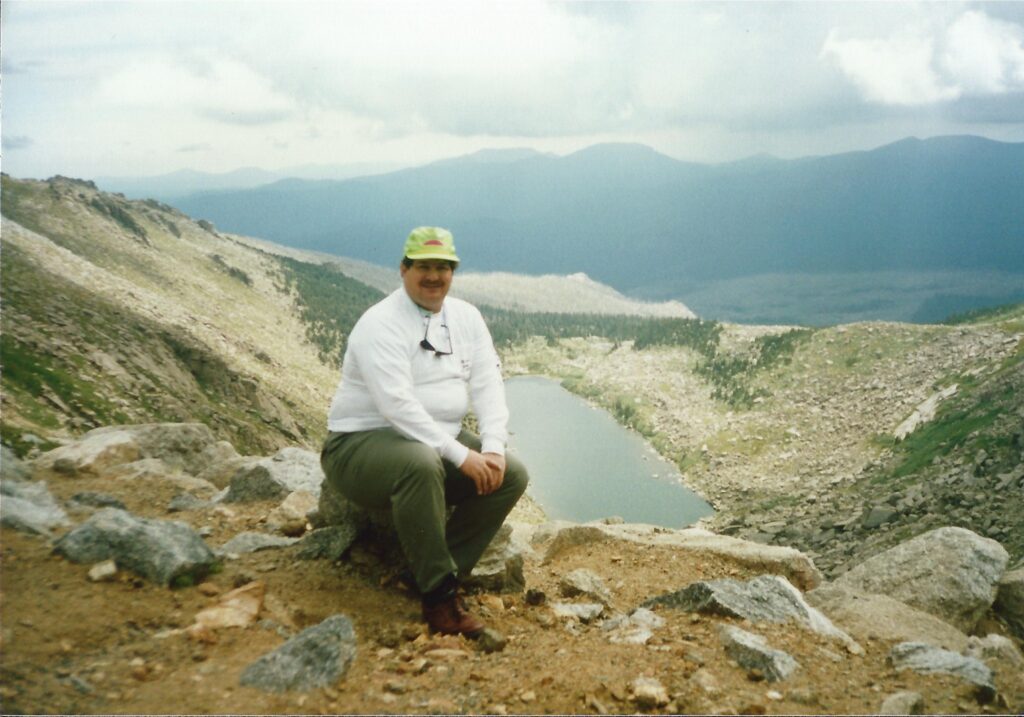 Sitting near the summit of Mt. Evans in Colorado overlooking Echo Lake in 1990. I love Colorado