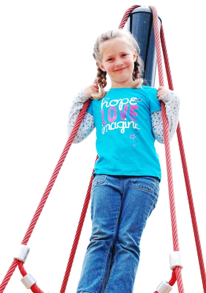 Livvy climbs the ropes to the top in a ark in Enumclaw