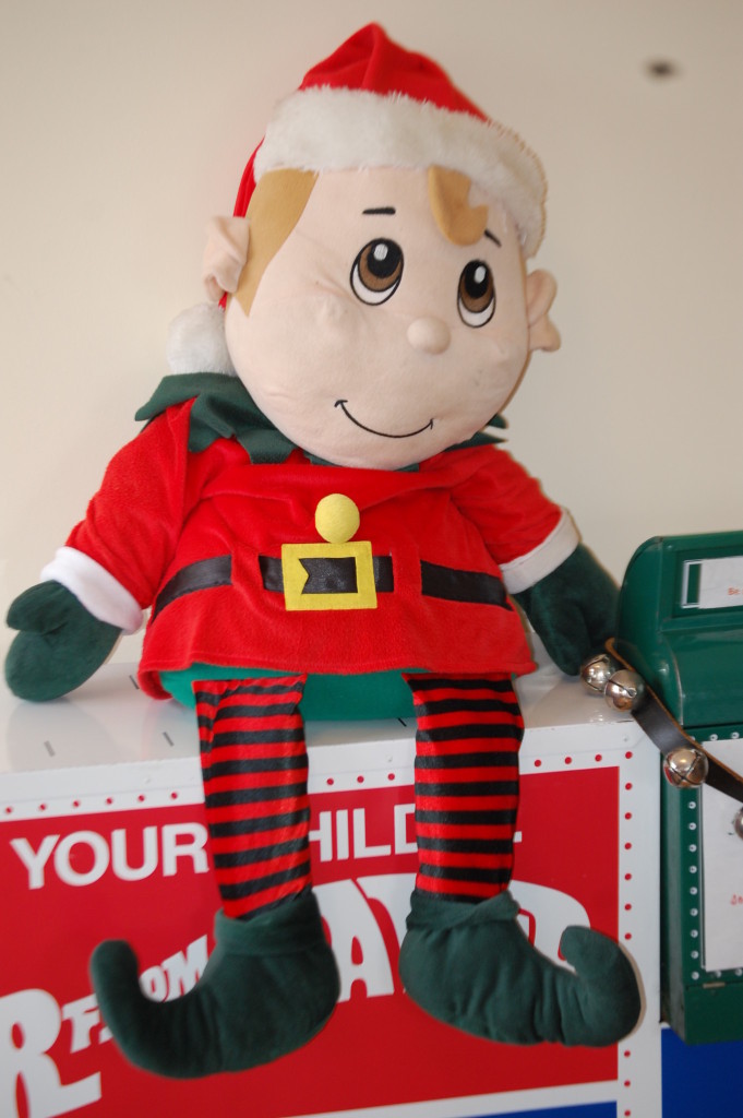 An elf guards the Santa Letter mailbox