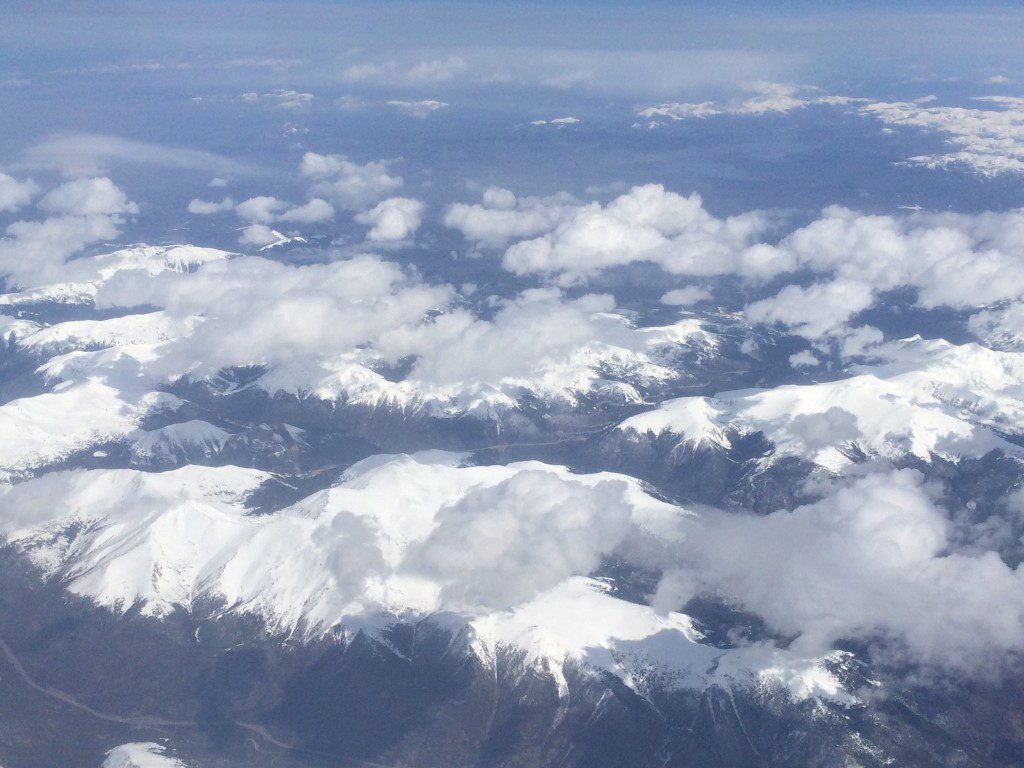 Flying over the snow-capped Rocky Mountains in Colorado, including Mt. Evans