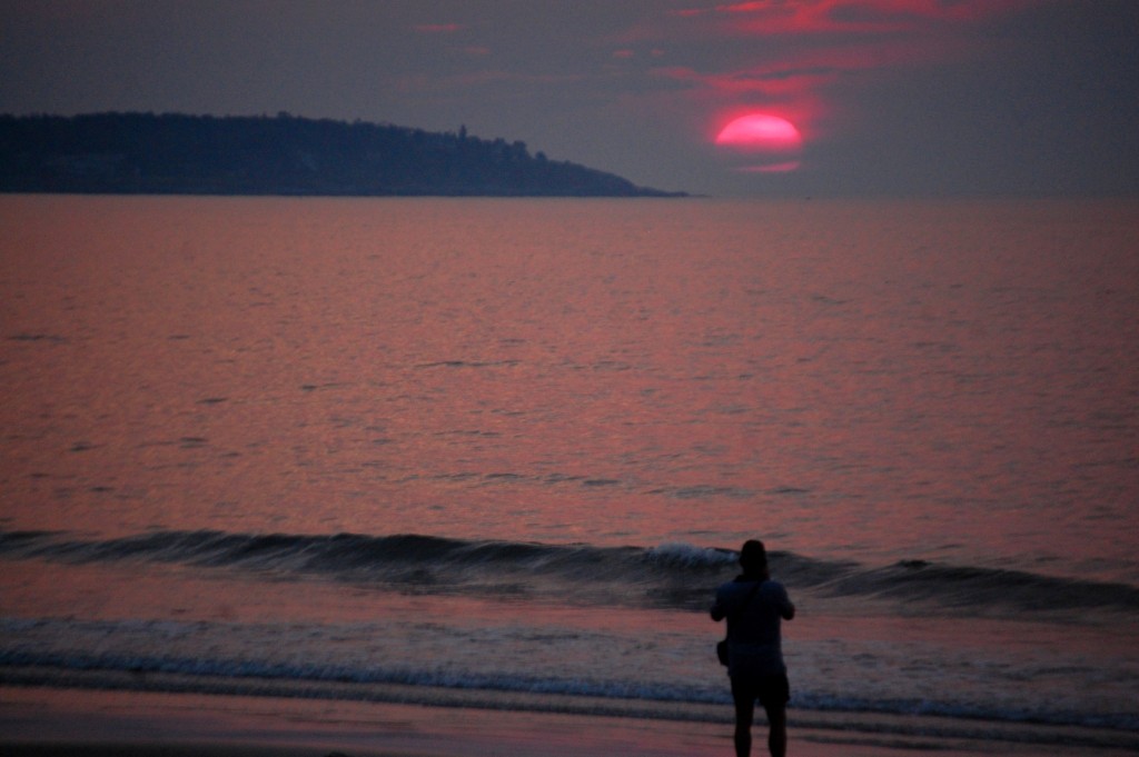 Someone on the beach also trying to catch the sunrise