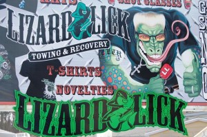 Lizard Lick Towing mural on sign outside of towing place