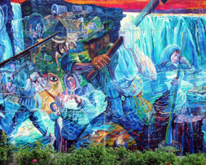 A portion of a massive mural on the side of a shopping mall. Entitled "History of the Niagara Peninsula" by Heinz Gaugel