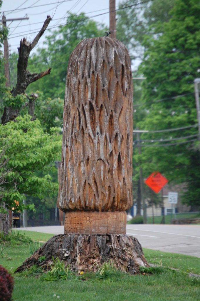 A large wooden carving of a mountain mushroom in downtown Irvine, KY