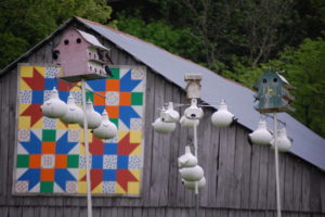 A quilt Block Barn and Gourd Houses for purple martins