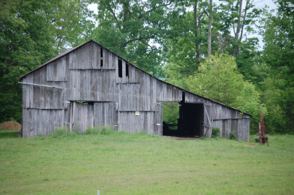 An old barn on the side of the highway. There are dozens of these.