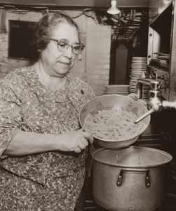 Mama Guarino making pasta in the kitchen